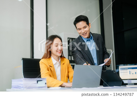 Kind leader executive manager share and discuss business solutions plan ideas on tablet with Asian male marketing manager 134249787