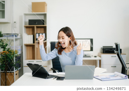 Business woman using tablet and laptop for doing math finance on an office desk, tax, Business woman using tablet and laptop for doing math finance on an office desk, tax, 134249871