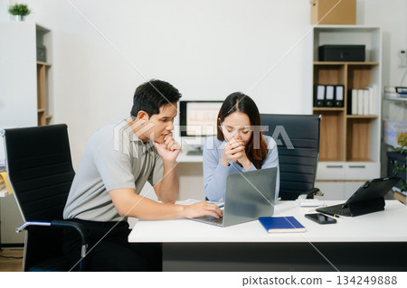Furious two Asian businesspeople arguing strongly after making a mistake at work 134249888