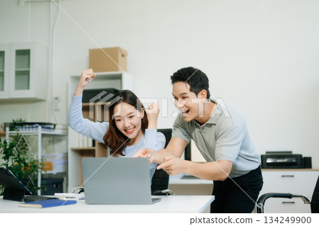 Asian business team creative businesspeople coworker, teamwork celebrating achievement and in planning design Asian business team creative businesspeople coworker, teamwork celebrating achievement and in planning design 134249900