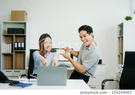 Asian business team creative businesspeople coworker, teamwork celebrating achievement and in planning design Asian business team creative businesspeople coworker, teamwork celebrating achievement and in planning design 134249901