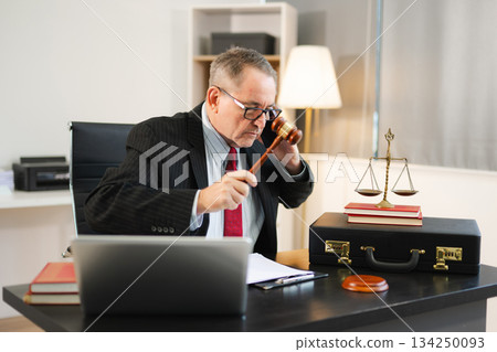Male judge in courtroom, lawyer working in office. Perfect for business, legal advice, corporate law 134250093
