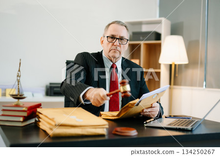 Male judge in courtroom, lawyer working in office. Perfect for business, legal advice, corporate law, and professional consulting themes. 134250267
