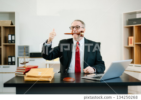Male judge in courtroom, lawyer working in office. Perfect for business, legal advice, corporate law, and professional consulting themes. 134250268