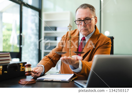Male judge in courtroom, lawyer working in office. Perfect for business, legal advice, corporate law Male judge in courtroom, lawyer working in office. Perfect for business, legal advice, corporate law 134250317
