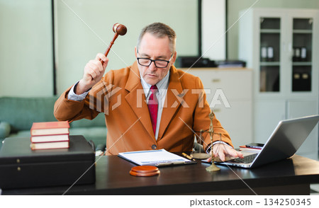 Man lawyer working and gavel, tablet, laptop in front, Advice justice and law concept. Man lawyer working and gavel, tablet, laptop in front, Advice justice and law concept. 134250345
