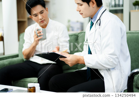 Doctor giving emotional support and medication advice to stressed male patient. Mental health, therapy, and care 134250494