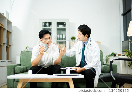 Doctor consulting with a stressed male patient in private clinic. Mental health care, therapy, empathy, and emotional support 134250525