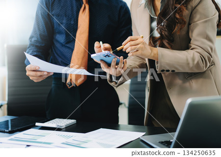 Team business meeting presentation. Hand businessman working project in modern office.Laptop computer and tablet and smart phone Team business meeting presentation. Hand businessman working project in modern office.Laptop computer and tablet and smart phone 134250635