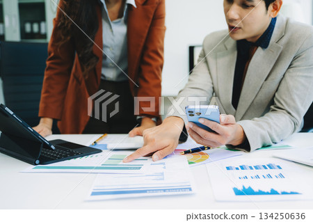 Team business meeting presentation. Hand businessman working project in modern office.Laptop computer and tablet and smart phone Team business meeting presentation. Hand businessman working project in modern office.Laptop computer and tablet and smart phone 134250636