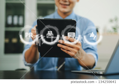 PR, Public relations concept. hands using laptop and tablet with public relations icon for communication advertising marketing strategy. PR, Public relations concept. hands using laptop and tablet with public relations icon for communication advertising marketing strategy. 134250641