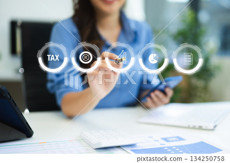 Business using a computer to complete Individual income tax return form online for tax payment.Tax and Vat concept. 134250758