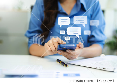 Woman hands  User typing on smartphone and tablet chatting conversation in chat box icon pop up for social media marketing technology concept. 134250761