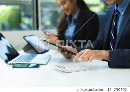 Business team meeting. professional investor working new start up project. Finance task. with smart phone and laptop and digital tablet Business team meeting. professional investor working new start up project. Finance task. with smart phone and laptop and digital tablet 134250792