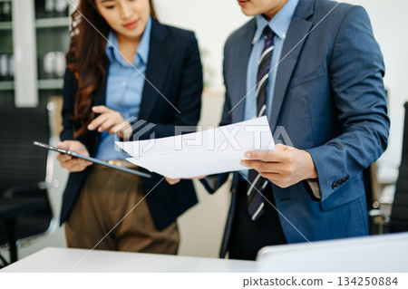 Team work process. Photo young business crew working with new startup project. Project managers meeting. 134250884