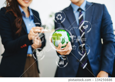 Business team meeting for ESG, net zero, and sustainability goals. Green energy, climate action, and eco-friendly strategies Business team meeting for ESG, net zero, and sustainability goals. Green energy, climate action, and eco-friendly strategies 134250886