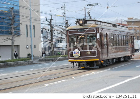Streetcars running through Kyoto 134251111