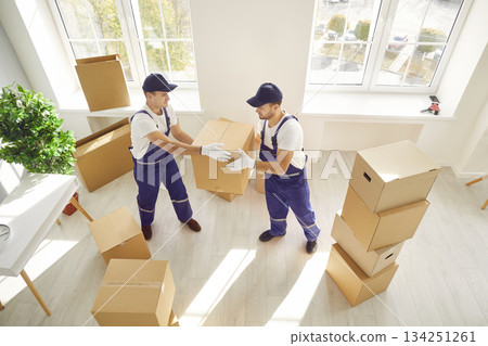 Two Movers Delivering Boxes at Home or Office 134251261