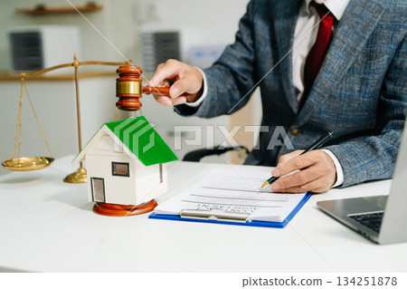 Real Estate Lawyer And House Foreclosure Law. House model, hammer judge gavel on table with white background. Real Estate Lawyer And House Foreclosure Law. House model, hammer judge gavel on table with white background. 134251878