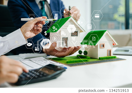 Sustainable architects presenting green building models, solar panels, and recycling symbols. Future clean energy and smart city Sustainable architects presenting green building models, solar panels, and recycling symbols. Future clean energy and smart city 134251913