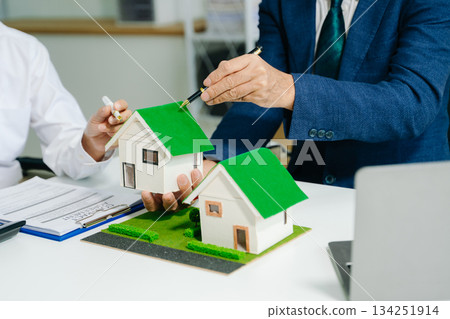 Sustainable architects presenting green building models, solar panels, and recycling symbols. Future clean energy and smart city Sustainable architects presenting green building models, solar panels, and recycling symbols. Future clean energy and smart city 134251914