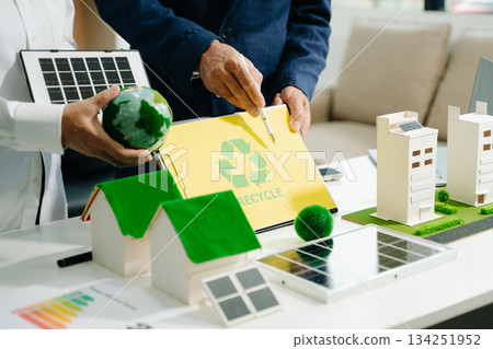 business team people planning and discussing on recycle reduce reuse policy symbol in office meeting room. 134251952