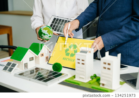 business team people planning and discussing on recycle reduce reuse policy symbol in office meeting room. business team people planning and discussing on recycle reduce reuse policy symbol in office meeting room. 134251973