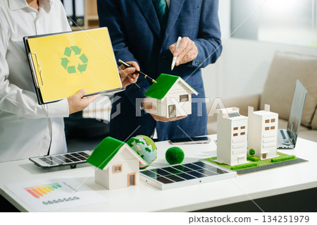 business team people planning and discussing on recycle reduce reuse policy symbol in office meeting room. 134251979