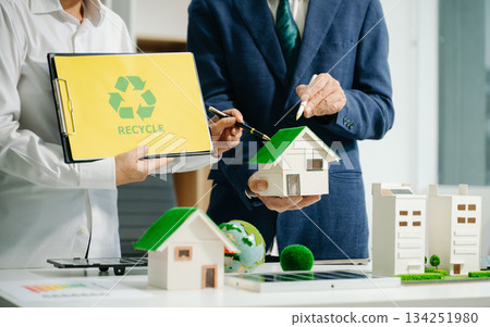 business team people planning and discussing on recycle reduce reuse policy symbol in office meeting room. 134251980
