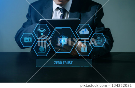 Zero trust security concept Person using computer and tablet with zero trust icon on virtual screen 134252081