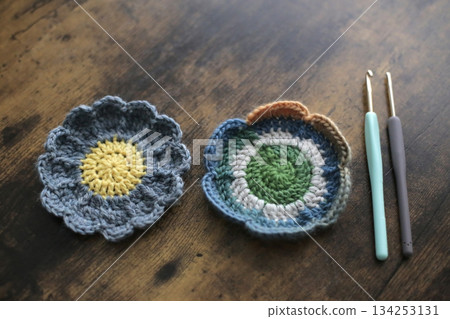 Balls of yarn, knitting needles, and craft projects 134253131