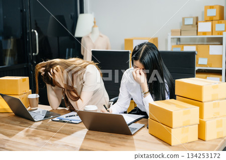 Asian team owner woman prepare parcel box  woman is stressed, bored, and overthinking from working 134253172