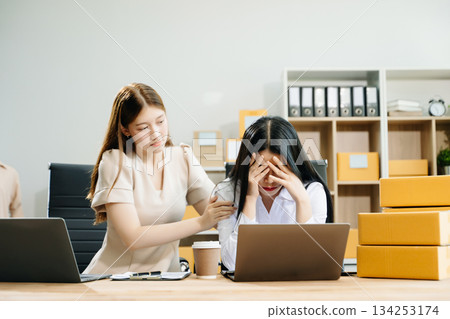 Asian team owner woman prepare parcel box  woman is stressed, bored, and overthinking from working 134253174