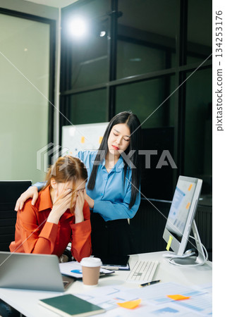 Furious two Asian businesspeople arguing strongly after making a mistake at work 134253176
