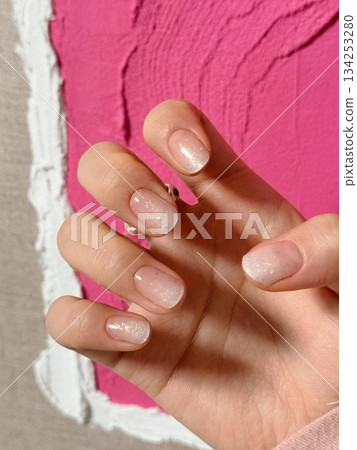 Beautiful nail art with intricate designs and vibrant colors, showcasing glossy finish, smooth texture, and detailed patterns in close-up view Beautiful nail art with intricate designs and vibrant colors, showcasing glossy finish, smooth texture, and detailed patterns in close-up view 134253280