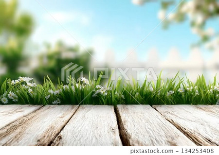 Spring background with fresh grass and white wooden table. Spring apple garden on the background Spring background with fresh grass and white wooden table. Spring apple garden on the background 134253408