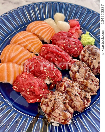 An assortment of fresh sushi, artfully arranged with a variety of toppings and vibrant colors. This traditional Japanese dish combines vinegared rice, seafood, and vegetables for an experience. An assortment of fresh sushi, artfully arranged with a variety of toppings and vibrant colors. This traditional Japanese dish combines vinegared rice, seafood, and vegetables for an experience. 134253827