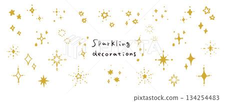 A set of hand-drawn glitter and sparkle elements. Star and sparkle decorations. 134254483