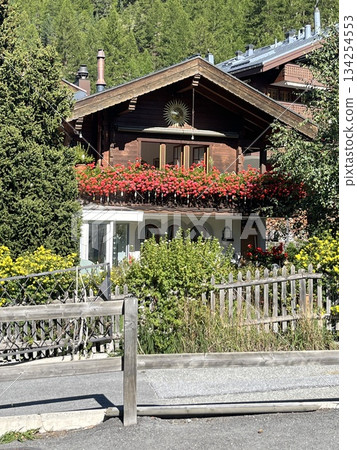 Balcony flower decorations at a Swiss mountain resort Balcony flower decorations at a Swiss mountain resort 134254553