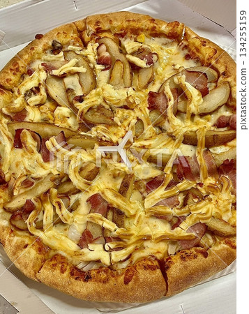 A delicious pizza with a golden crust, melted cheese, and savory toppings. Perfect for food-related designs, menus, or Italian-themed projects, capturing the essence of a classic comfort dish. 134255159