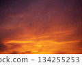 Abstract Texture of Intense Sunset Sky with Orange, Red, and Purple Hues 134255253