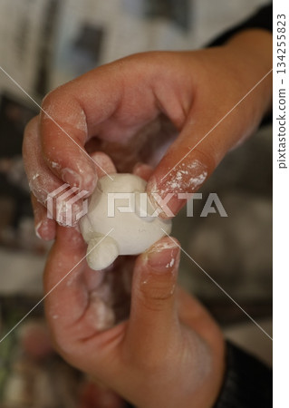 Children's hands kneading clay - craft time to develop creativity Children's hands kneading clay - craft time to develop creativity 134255823