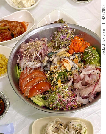 A vibrant poke bowl filled with fresh diced fish, vegetables, and flavorful toppings. Perfect for food photography, this dish embodies the essence of healthy, colorful eating and Hawaiian-inspired. A vibrant poke bowl filled with fresh diced fish, vegetables, and flavorful toppings. Perfect for food photography, this dish embodies the essence of healthy, colorful eating and Hawaiian-inspired. 134257092