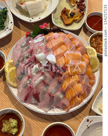 Fresh and delicate sashimi slices, beautifully presented with vibrant colors and perfect cuts. This traditional Japanese delicacy highlights the pure flavors of premium seafood. Fresh and delicate sashimi slices, beautifully presented with vibrant colors and perfect cuts. This traditional Japanese delicacy highlights the pure flavors of premium seafood. 134257135