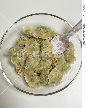 Delicious Korean mandu dumplings with a golden, crispy exterior and flavorful filling. Perfect as an appetizer, snack, or side dish, offering a delightful taste in every bite. Delicious Korean mandu dumplings with a golden, crispy exterior and flavorful filling. Perfect as an appetizer, snack, or side dish, offering a delightful taste in every bite. 134257203