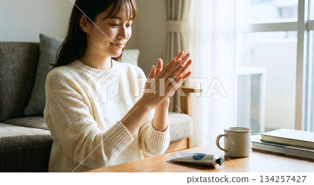 Women painting hand cream 134257427