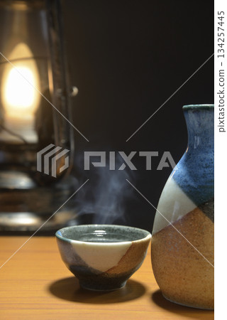 Steaming sake and a lantern Steaming sake and a lantern 134257445