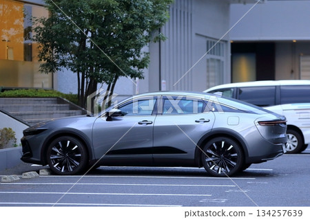 Image of a sedan in a parking lot Image of a sedan in a parking lot 134257639