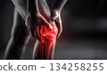Man holding painful inflamed knee joint 134258255