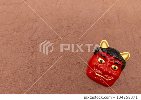 Red demon on brown Japanese paper background Setsubun 134258371